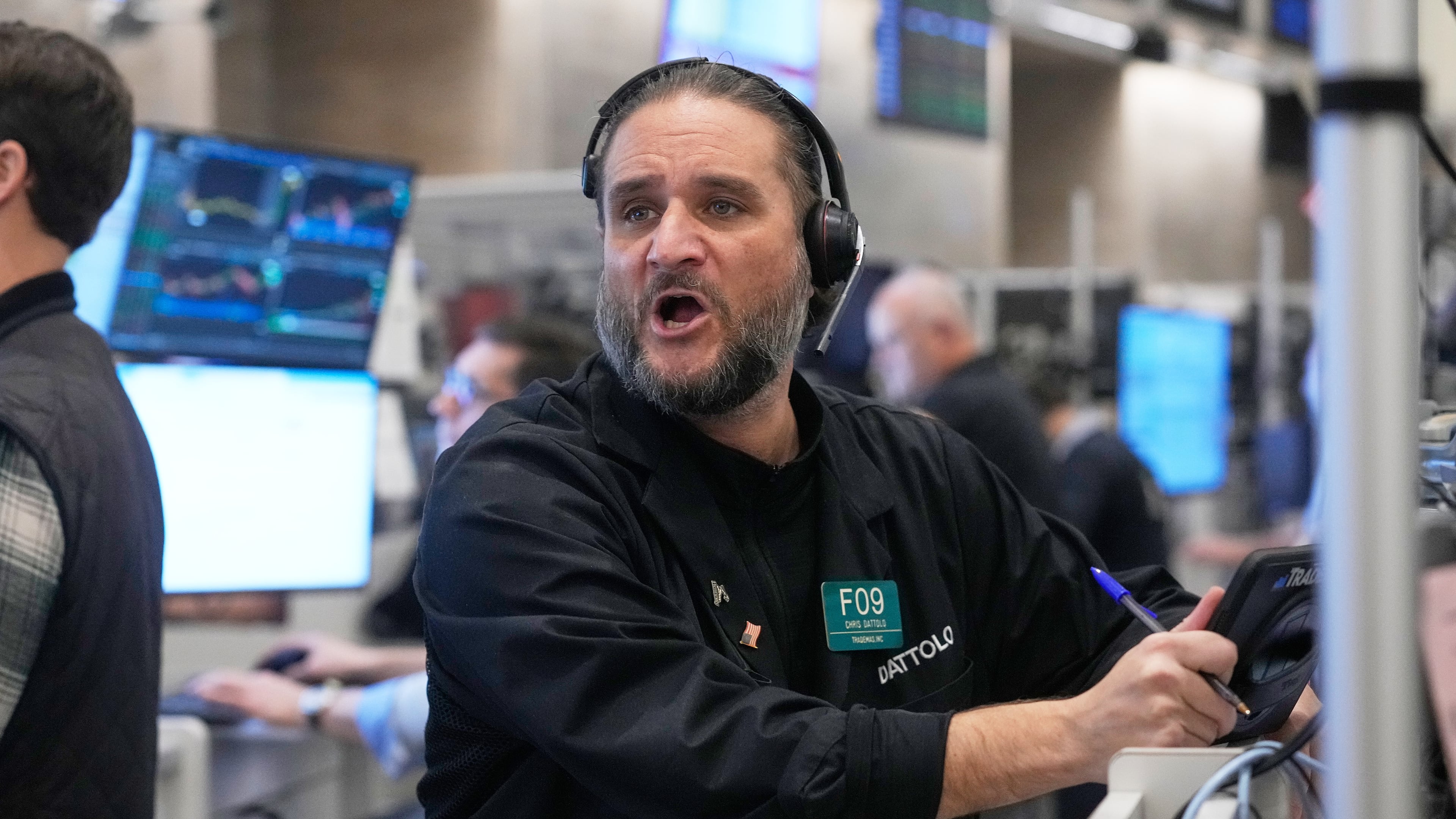 Options trader Chris Dattolo works on the floor of the New York Stock Exchange, Wednesday, Nov. 12, 2025. (AP Photo/Richard Drew)