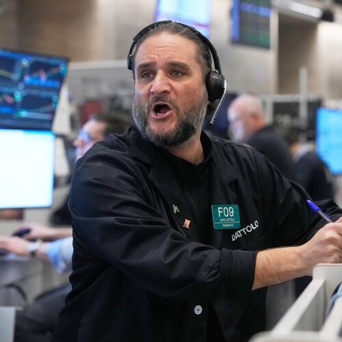Options trader Chris Dattolo works on the floor of the New York Stock Exchange, Wednesday, Nov. 12, 2025. (AP Photo/Richard Drew)