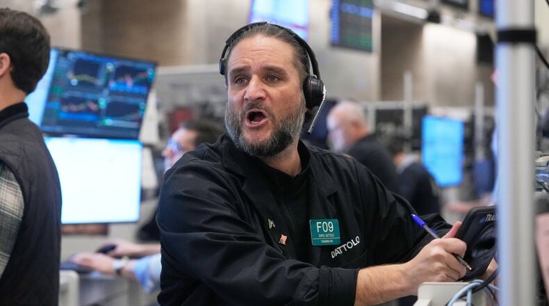 Options trader Chris Dattolo works on the floor of the New York Stock Exchange, Wednesday, Nov. 12, 2025. (AP Photo/Richard Drew)