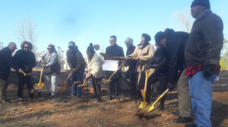 South Fulton city officials and workers, on the right, joint area residents, on the left, to break ground on safety improvements at the corner of Campbellton Road and Stonewall Tell Road on March 20, 2023.