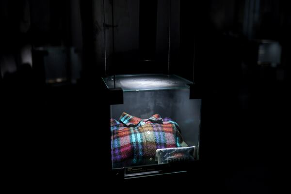 A shirt found in a mass grave is shown as a part of the exhibition "Lives Beyond the Fields of Death" opened at the Srebrenica Memorial Center in Potocari, Bosnia, Thursday, July 10, 2025. (AP Photo/Armin Durgut)
