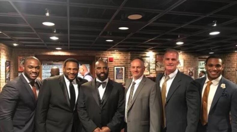The late Tim Lester, third from the left, was an Eastern Kentucky University alumni. He was inducted into the Kentucky Pro Football Hall of Fame in 2018 and was introduced by Jerome Bettis, second from left, during the ceremony. Courtesy Alan Brock
