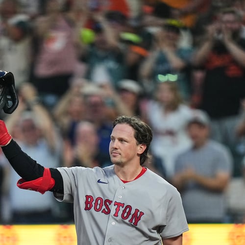 Boston Red Sox catcher Adley Rutschman acknowledges the crowd as he is honored during the first inning of a baseball game against the Baltimore Orioles, Thursday, Sept. 3, 2026, in Baltimore. (AP Photo/Stephanie Scarbrough)