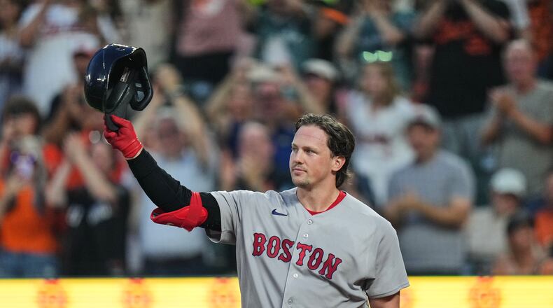 Boston Red Sox catcher Adley Rutschman acknowledges the crowd as he is honored during the first inning of a baseball game against the Baltimore Orioles, Thursday, Sept. 3, 2026, in Baltimore. (AP Photo/Stephanie Scarbrough)