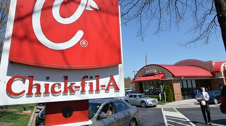 April 1, 2014 Dunwoody - Cars waiting to get to the drive thru at the Chick-fil-A Duwoondy location on Tuesday, April 1, 2014. Chick fil A has added to its lead in surpassing KFC as America's number one purveyor of friend chicken. Sales went beyond $5 billion, and this did this all with a fraction of the stores fronted by the Colonel.We get the info and trying for reax from Yum Brands, the owner of KFC. HYOSUB SHIN / HSHIN@AJC.COM