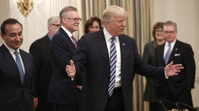 President Donald Trump welcomes members of the airline industry to a meeting at the White House on Thursday. Delta CEO Ed Bastian is just to the left of Trump in this photo. (Photo by Win McNamee/Getty Images)