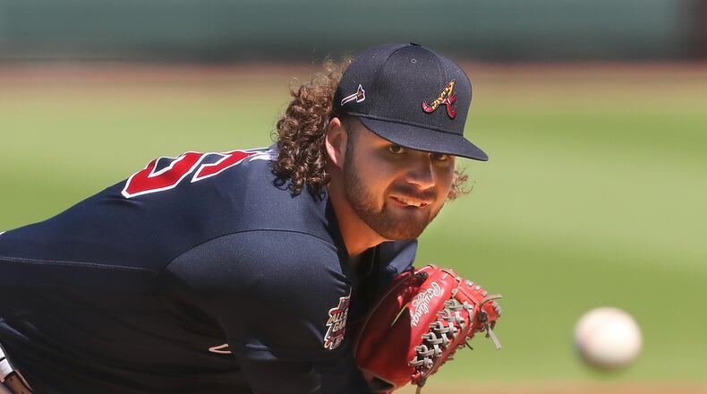030421 Bradenton: Atlanta Braves starting pitcher Bryse Wilson delivers against the Pittsburgh Pirates during the first inning of a MLB spring training baseball game at LECOM Park on Thursday, March 4, 2021, in Bradenton.   “Curtis Compton / Curtis.Compton@ajc.com”
