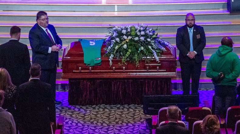 The coffin of Roswell High School football player Robbie Roper is moved into the church before the start of his funeral service at the First Baptist Church of Woodstock on Tuesday, Dec. 28, 2021.   STEVE SCHAEFER FOR THE ATLANTA JOURNAL-CONSTITUTION
