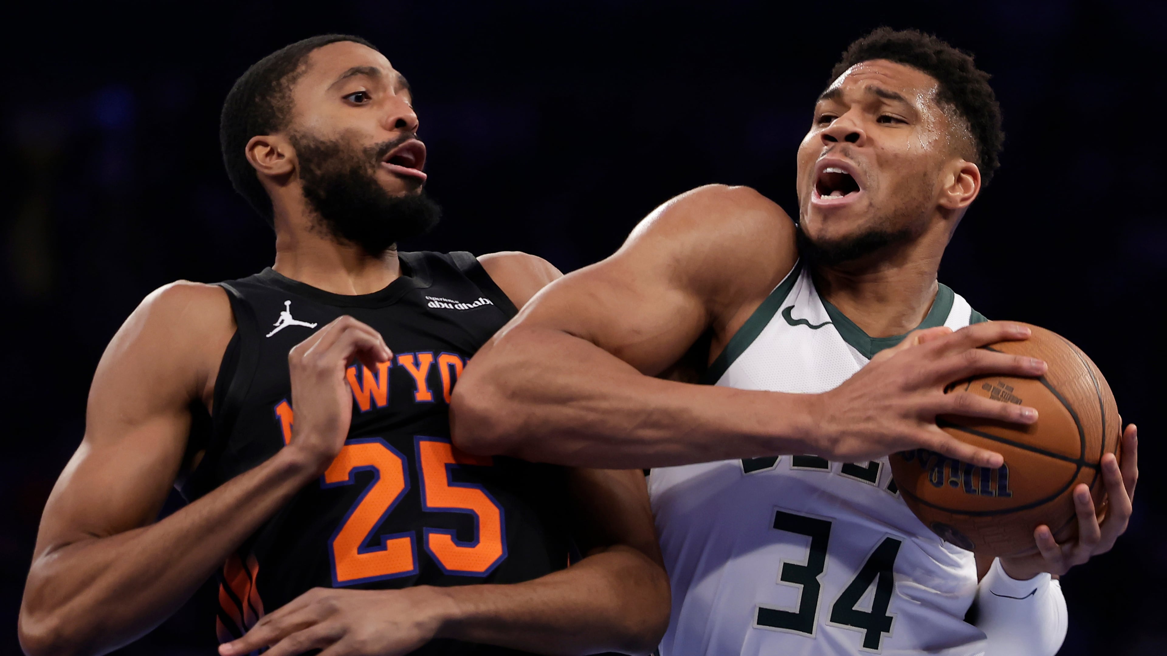 Milwaukee Bucks forward Giannis Antetokounmpo (34) drives past New York Knicks guard Mikal Bridges (25) during the first half of an NBA Cup basketball game Friday, Nov. 28, 2025, in New York. (AP Photo/Adam Hunger)