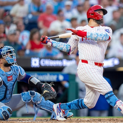 Philadelphia Phillies' Kyle Schwarber, right, hits a three-run home run during the second inning of a baseball game against the New York Mets, Sunday, June 21, 2026, in Philadelphia. (AP Photo/Chris Szagola)