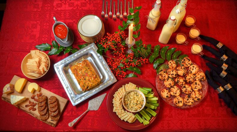 Home Made Fruit Salami with Cheese Platter (lower left), Christiane’s Dinner Party Terrine (second from left), Deviled Crab Dip (center lower) and Fruitcake Cookies (right). Food styling by Ligaya Figueras. CHRIS HUNT / SPECIAL