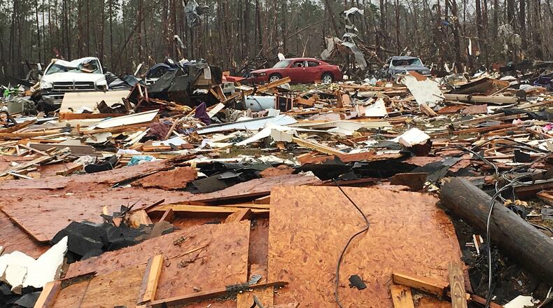 ADDS DATE - Mobile homes and vehicles lie destroyed Monday, Jan. 23, 2017, by severe weather over the weekend in Cook County, Ga. Gov. Nathan Deal declared a state of emergency in several counties, including Cook, that have suffered deaths, injuries and severe damage from weekend storms and expanded it Monday to include additional counties in southern Georgia. (AP Photo/Brendan Farrington)