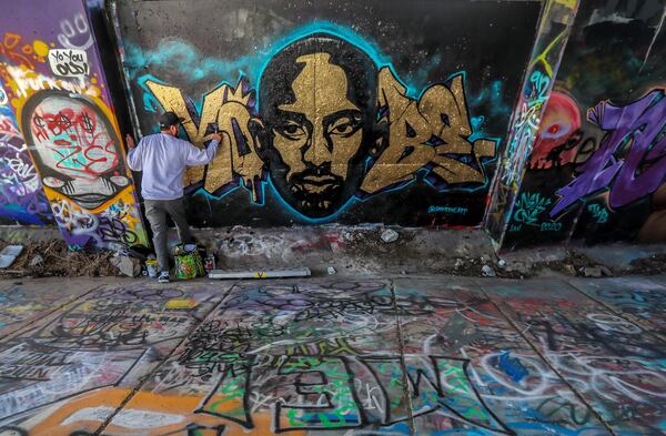 January 24, 2020 Atlanta: Atlanta area artist, Nels worked on the finishing touches of his Kobe Bryant mural on Tuesday. Two Atlanta area artists, Era (not pictured) and Nels finished doing touch ups on their two separate and individually painted murals honoring the late NBA superstar Kobe Bryant on Tuesday, Jan. 28, 2020.  The murals were begun on Monday along the Beltline not far from the Baby Yodas murals near the Historic Fourth Ward Skatepark. âThe City of Atlanta joins the world in mourning the loss of Kobe Bryant, his daughter Gianna, and all the other passengers on board. Our thoughts and prayers are with their family and friends,â officials said. JOHN SPINK/JSPINK@AJC.COM
