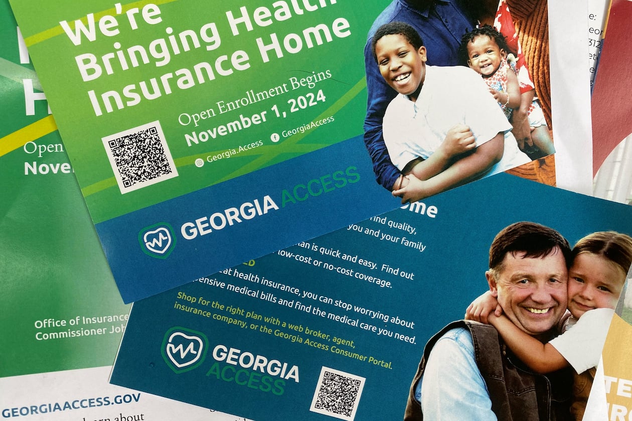 Promotional materials for GeorgiaAccess.gov distributed at a Georgia Access launch event Friday, Nov. 1, 2024, near the Georgia Capitol.  Georgia Access is the state-based exchange marketplace for the Affordable Care Act in Georgia. (Ariel Hart/AJC)