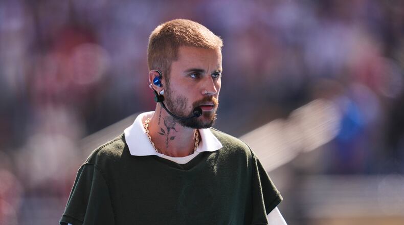 Justin Bieber leaves the pitch after performing at halftime during the World Cup final soccer match between Spain and Argentina in East Rutherford, N.J., near New York, Sunday, July 19, 2026. (AP Photo/Abbie Parr)