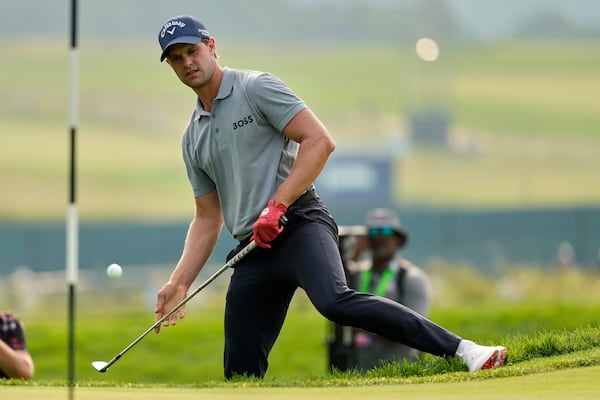 Thomas Detry, of Belgium, chips onto the fourth green during the second round of the U.S. Open golf tournament at Oakmont Country Club Friday, June 13, 2025, in Oakmont, Pa. (AP Photo/Carolyn Kaster)