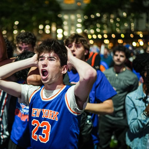 A New York Knicks fan cheers at a watch party during Game 3 of the NBA Finals basketball series between the Knicks and the San Antonio Spurs, Monday, June 8, 2026, in New York. (AP Photo/Ryan Murphy)