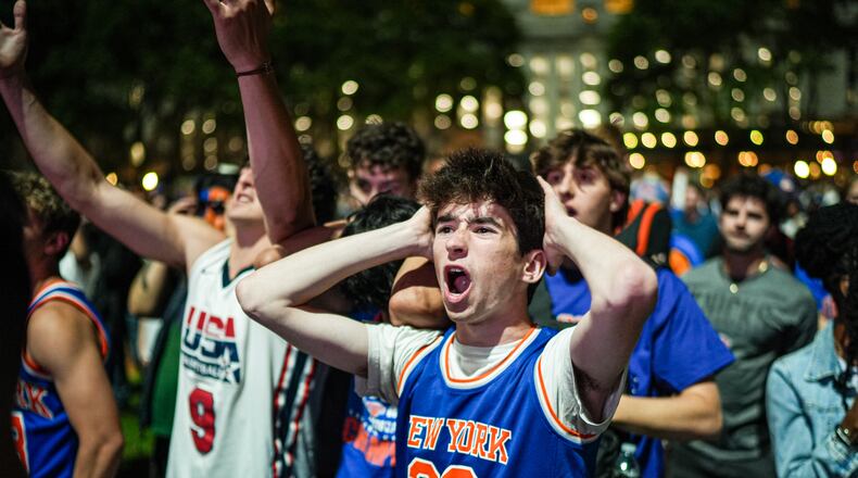 A New York Knicks fan cheers at a watch party during Game 3 of the NBA Finals basketball series between the Knicks and the San Antonio Spurs, Monday, June 8, 2026, in New York. (AP Photo/Ryan Murphy)