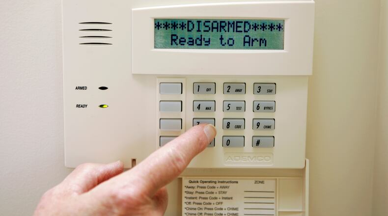 Security companies are beginning to pay fines for false alarms to Sandy Springs, removing themselves from the city's list of revoked registrations.