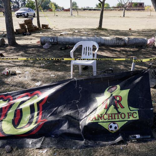 Crime scene tape surrounds a soccer field the day after gunmen opened fire, killing and wounding people, in Salamanca, Mexico, Monday, Jan. 26, 2026. (AP Photo/Mario Armas)