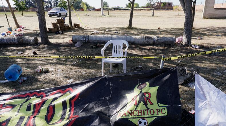 Crime scene tape surrounds a soccer field the day after gunmen opened fire, killing and wounding people, in Salamanca, Mexico, Monday, Jan. 26, 2026. (AP Photo/Mario Armas)