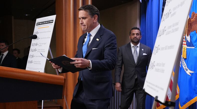 Acting Attorney General Todd Blanche and FBI Director Kash Patel arrive for a news conference at the Justice Department, Tuesday, April 21, 2026, in Washington. (AP Photo/Jacquelyn Martin)
