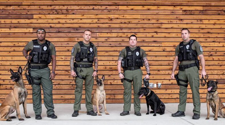 Photo from the autumn of 2017 depicts the Woodstock police K9 unit when it was recertified and recognized at the South Georgia K-9 Training and Certification Workshop in Perry: Officer Nik Petit-Alleyne and K9 Rex (from left), Officer Jarred Jackson and K9 Exo, Officer Mathew Dunn and K9 Rosa, and Officer Daniel Butler and K9 Dugan. CITY OF WOODSTOCK