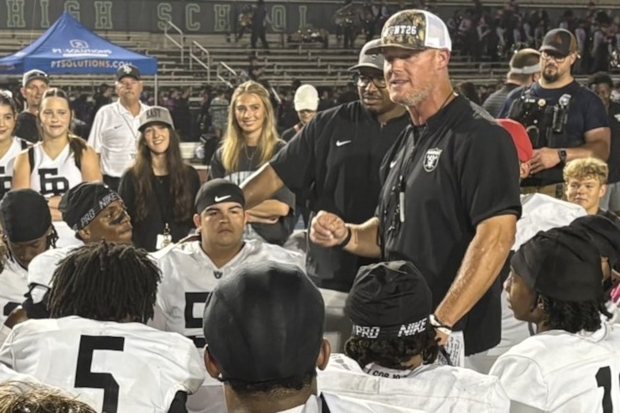 East Paulding coach Van Spence talks to his players after the Raiders' 27-23 victory over Harrison at Cobleigh Stadium on Aug. 28, 2026. (Chip Saye/AJC)