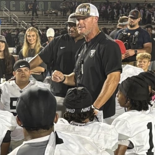 East Paulding coach Van Spence talks to his players after the Raiders' 27-23 victory over Harrison at Cobleigh Stadium on Aug. 28, 2026. (Chip Saye/AJC)