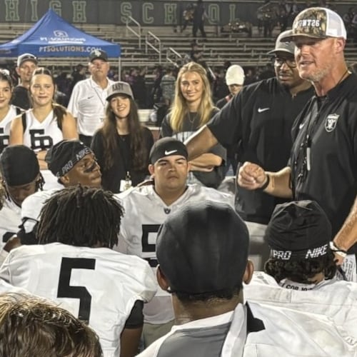 East Paulding coach Van Spence talks to his players after the Raiders' 27-23 victory over Harrison at Cobleigh Stadium on Aug. 28, 2026. (Chip Saye/AJC)
