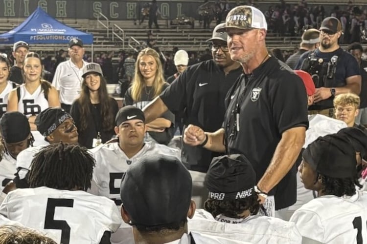 East Paulding coach Van Spence talks to his players after the Raiders' 27-23 victory over Harrison at Cobleigh Stadium on Aug. 28, 2026. (Chip Saye/AJC)