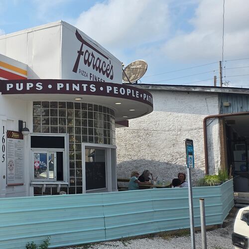 The exterior of a retro pizza joint called Farace's in Savannah GA.