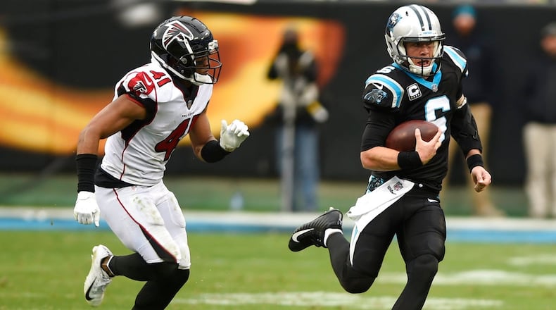 Carolina Panthers' Taylor Heinicke scrambles against the Atlanta Falcons during the second half of an NFL football game in Charlotte, N.C., Sunday, Dec. 23, 2018. (AP Photo/Mike McCarn)