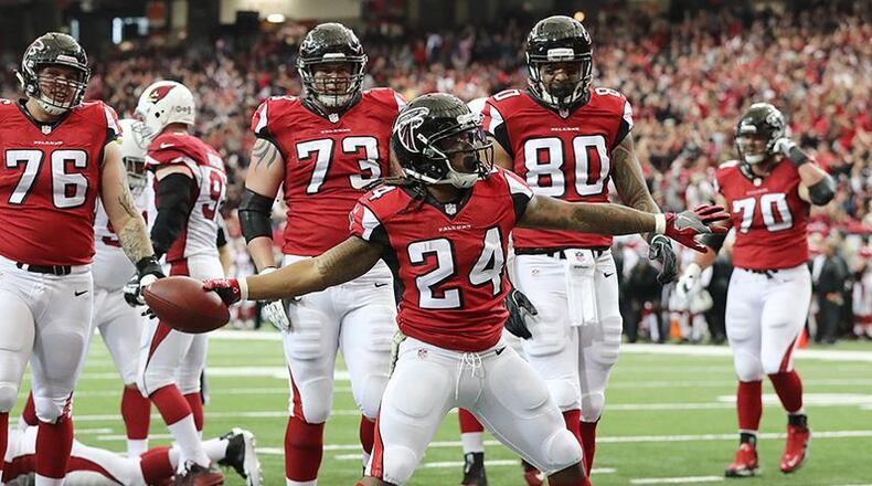 Falcons running back Devonta Freeman spikes the ball after scoring a touchdown against the Arizona Cardinals to tie the game 7-7 during the first quarter Sunday, Nov. 27, 2016, at the Georgia Dome in Atlanta. (Curtis Compton/ccompton@ajc.com)