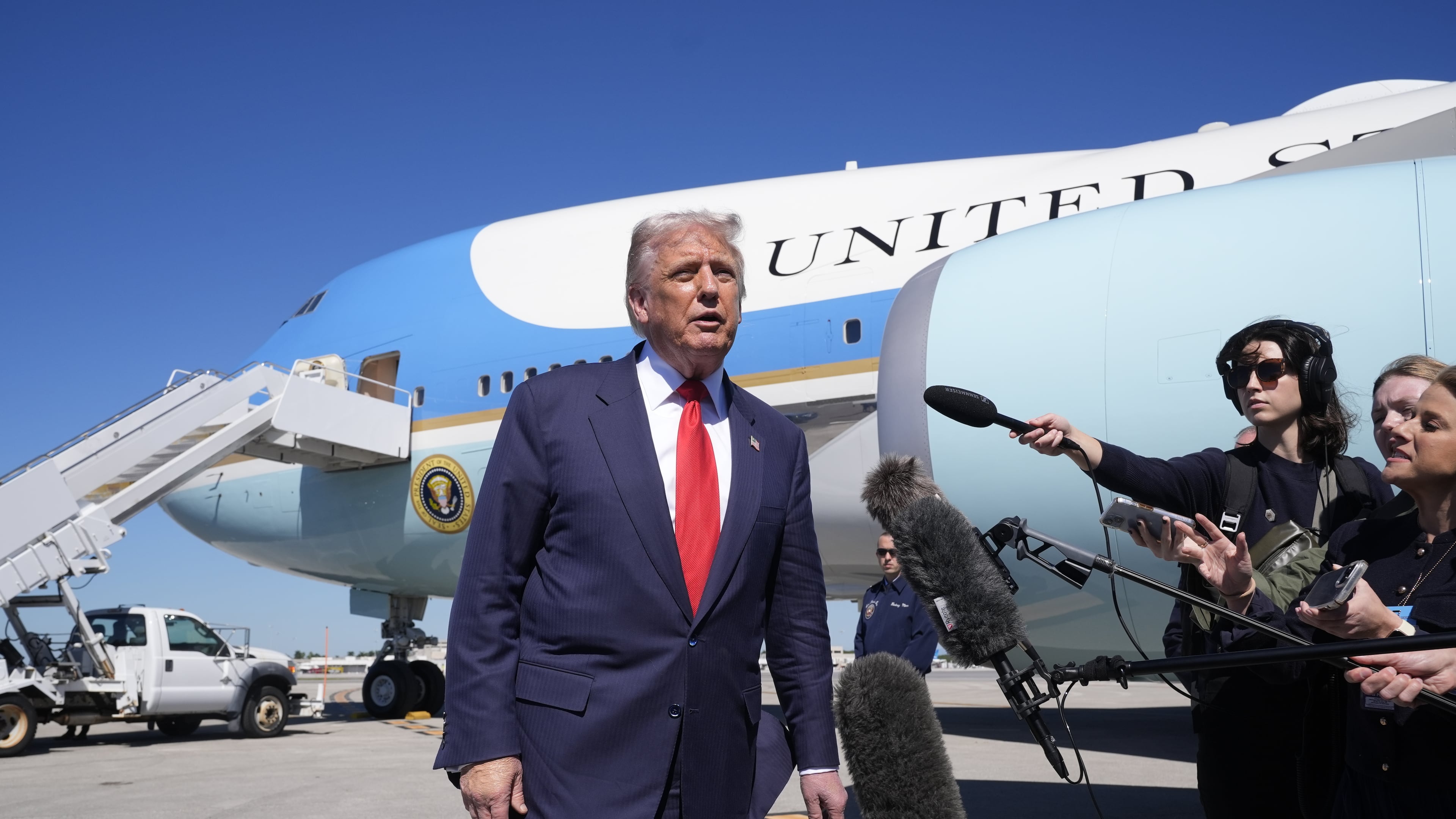 President Donald Trump speaks to the media after arriving at Palm Beach International Airport, Friday, Oct. 31, 2025, in West Palm Beach, Fla. (AP Photo/Manuel Balce Ceneta)