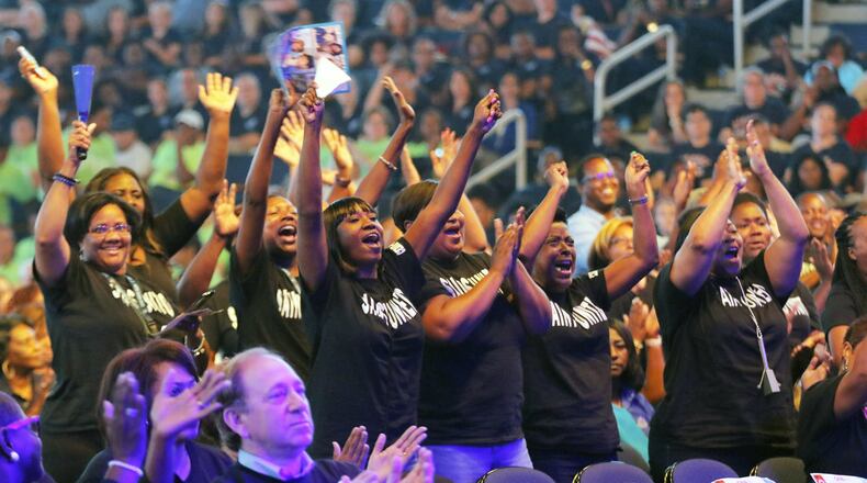 DeKalb County School District teachers and staff cheer performers at a back-to-school convocation in August in Duluth. BOB ANDRES /BANDRES@AJC.COM