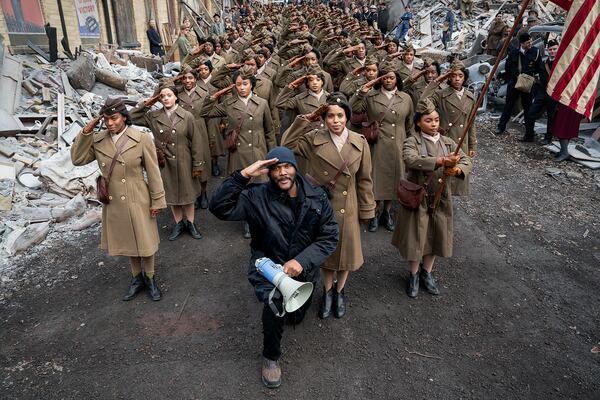 Writer, director and producer Tyler Perry, Kerry Washington and the cast of "Six Triple Eight." (Laura Radford/Perry Well Films 2/Netflix/TNS)