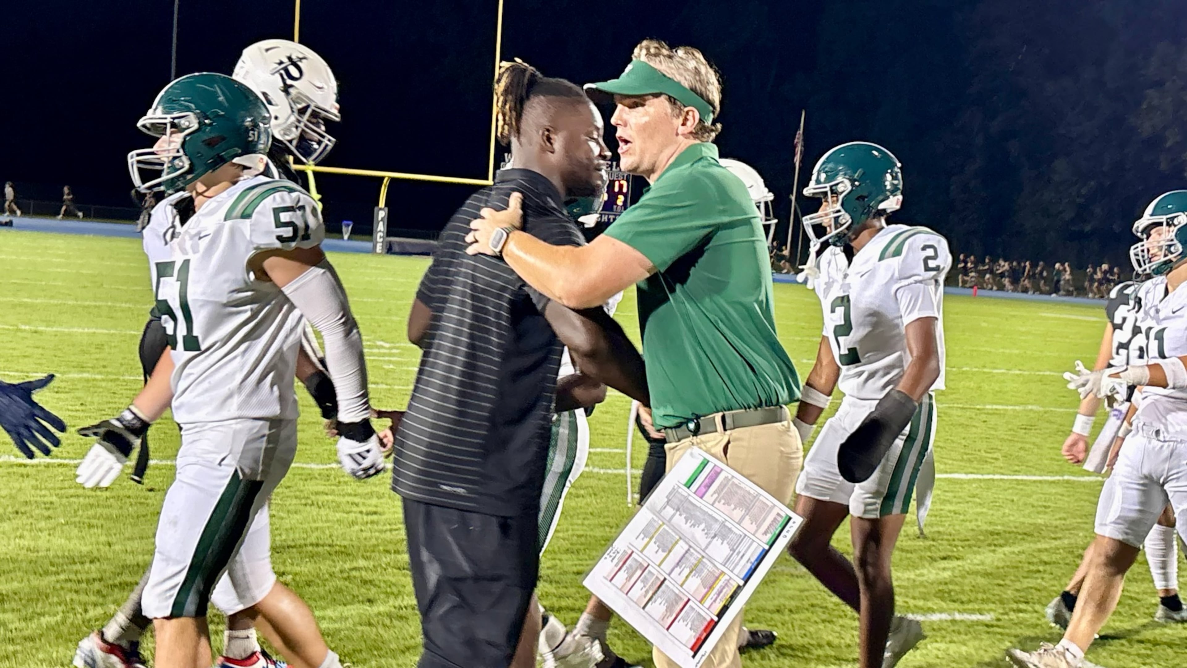Pace Academy coach and former Falcons linebacker Sean Weatherspoon (left) shakes hands with Westminster coach Nelson Stewart following their game Friday, Aug. 22, 2025, at Pace's Walsh Field in Atlanta. Westminster prevailed 17-7. (Ken Sugiura/AJC)