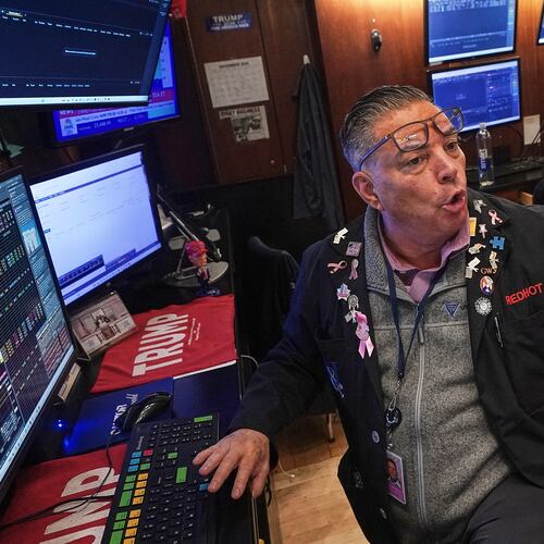 Trader Jonathan Mueller works on the floor of the New York Stock Exchange, Thursday, Dec. 11, 2025. (AP Photo/Richard Drew)
