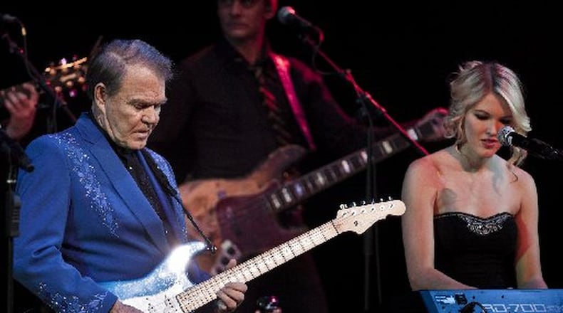 Glen Campbell performs alongside his daughter, Ashley Campbell, during the “Goodbye Tour,” less than a year after he disclosed his diagnosis of Alzheimer’s disease, in New York, Jan. 7, 2012. Campbell, a sharecropper’s son who became a major country music and television star of the 1960s and ’70s, died in Nashville on Aug. 8, 2017. He was 81. CHAD BATKA / THE NEW YORK TIMES