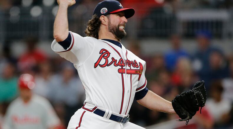 R.A. Dickey works against the Philadelphia Phillies during the seventh inning of Thursday's game.