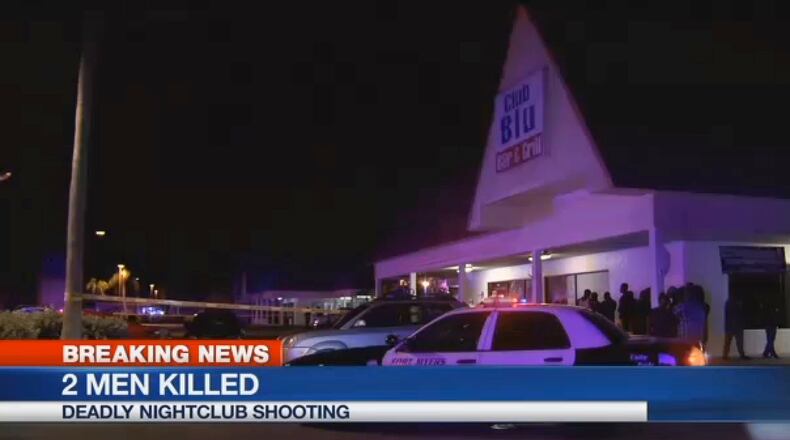 In this frame from video, people gather near the scene of a fatal shootings at Club Blu nightclub in Fort Myers, Fla., Monday, July 25, 2016. (WBBH via AP)