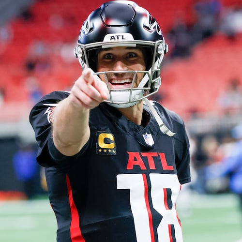 Falcons quarterback Kirk Cousins signals to the fans during warm-ups before the Falcons face the Los Angeles Chargers on Sunday, December 1, 2024, at Mercedes-Benz Stadium in Atlanta.
(Miguel Martinez/AJC)