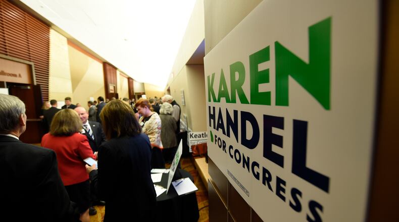 The scene at a Sixth District debate in Marietta last month. Henry Taylor, henry.taylor@ajc.com
