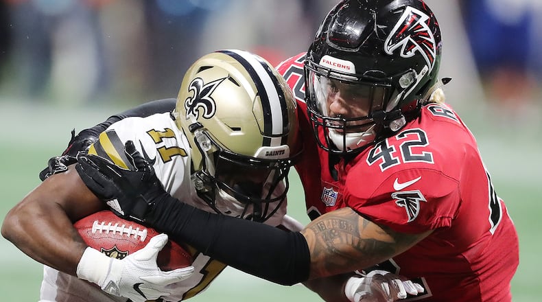 Falcons linebacker Duke Riley tackles Saints wide receiver Tommylee Lewis Thursday, Dec. 7, 2017, in Atlanta.