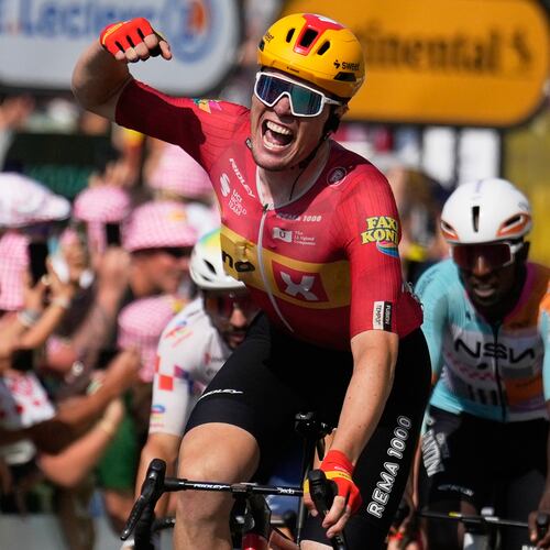 Norway's Soren Waerenskjold celebrates as he crosses the finish line to win the eleventh stage of the Tour de France cycling race with start in Vichy and finish in Nevers, France, Wednesday, July 15, 2026. (AP Photo/Mosa'ab Elshamy)