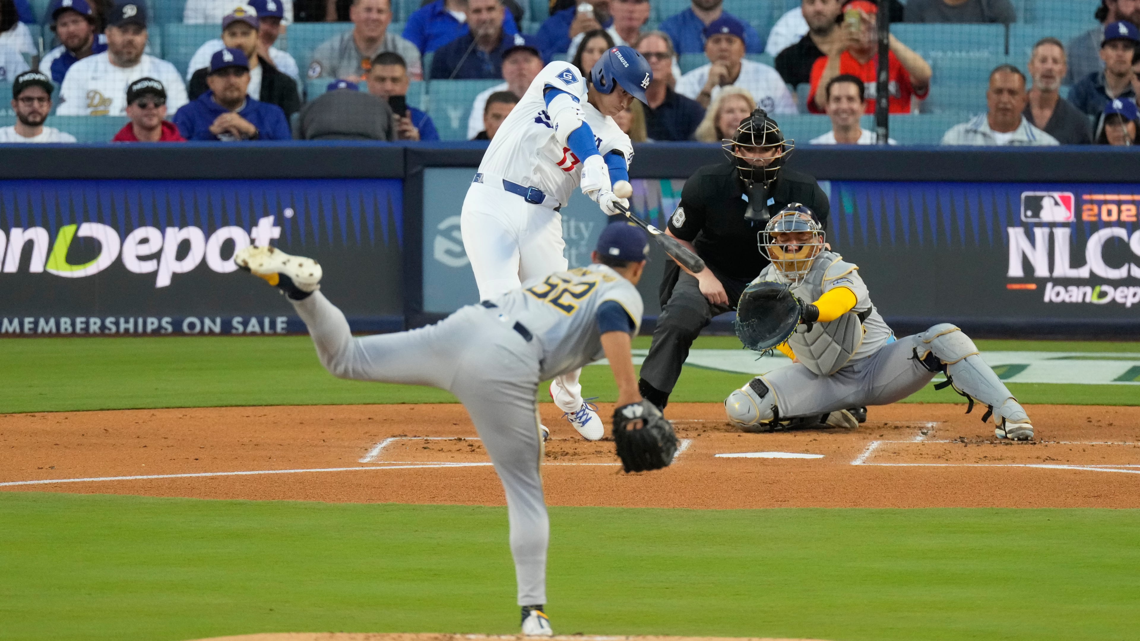 Los Angeles Dodgers' Shohei Ohtani hits a home run against the Milwaukee Brewers during the first inning in Game 4 of baseball's National League Championship Series, Friday, Oct. 17, 2025, in Los Angeles. (AP Photo/Mark J. Terrill)