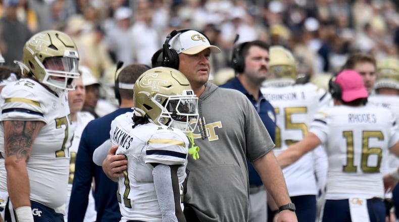 Georgia Tech head coach Brent Key celebrates Georgia Tech running back Jamal Haynes (11) after he scored a touchdown during the first half of an NCAA college football game at Georgia Tech's Bobby Dodd Stadium, Saturday, November 9, 2024, in Atlanta. (Hyosub Shin / AJC)