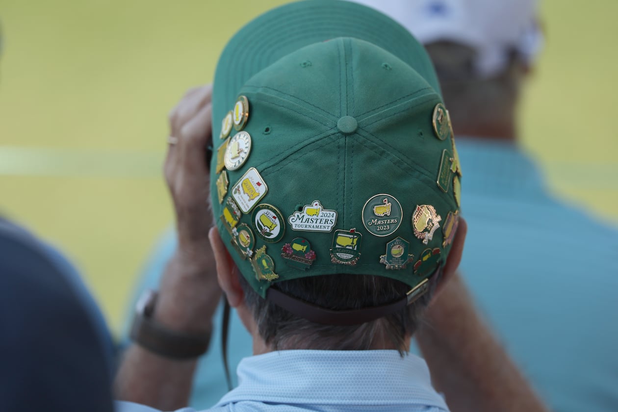 Masters patron watches the action on sixth green during second round of the Masters golf tournament, at Augusta National Golf Club, Friday, April 11, 2025, in Augusta, Ga. (Jason Getz / AJC)