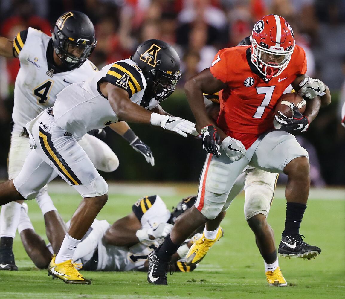 Photos: Bulldogs win but QB Jacob Eason is injured